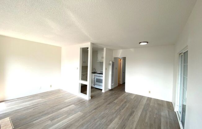 Open House Sat. July 5th from 12-1 PM: Updated top-floor 2-bedroom 1-bath corner apartment with a private balcony near BART