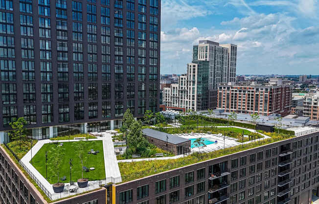 A modern building with a green roof and a swimming pool at Allied Harbor Point, Baltimore