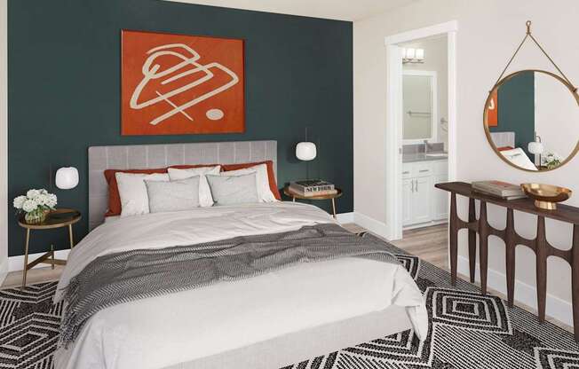 A bedroom with a large bed and a painting on the wall.