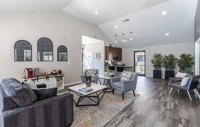 a living room with couches and chairs and a table