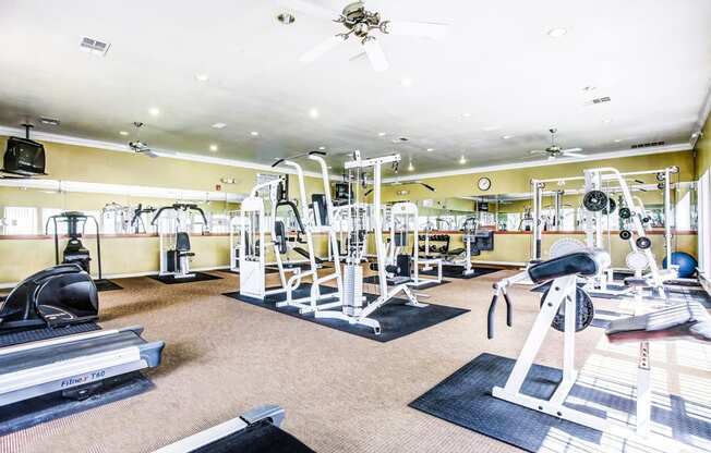 High energy fitness center fully equipped with fitness equipment in the Trinity Square Apartment Homes in North Dallas, TX!