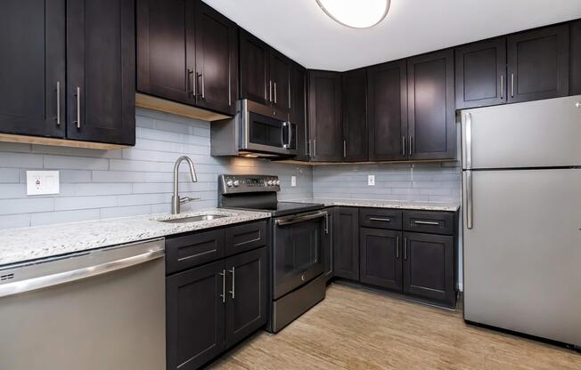 a large kitchen with stainless steel appliances