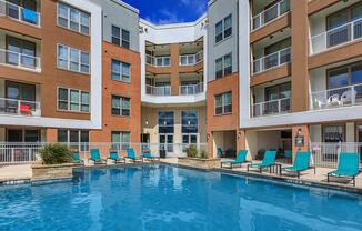 a large pool of water in front of a building