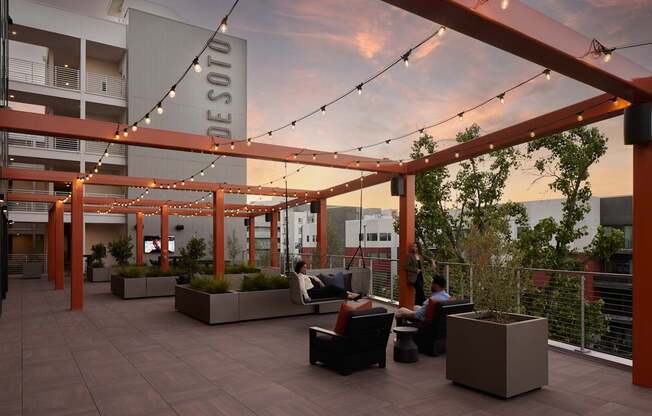 A Desoto sign is hanging from a pergola on a patio.