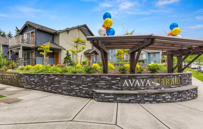 Avaya Trails Wall with Logo, Cement Path, Apartment Exteriors, Greenery and Baloons