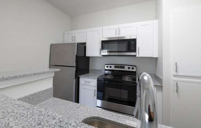 Renovated kitchen featuring appliances at Center Point Apartments, Indianapolis