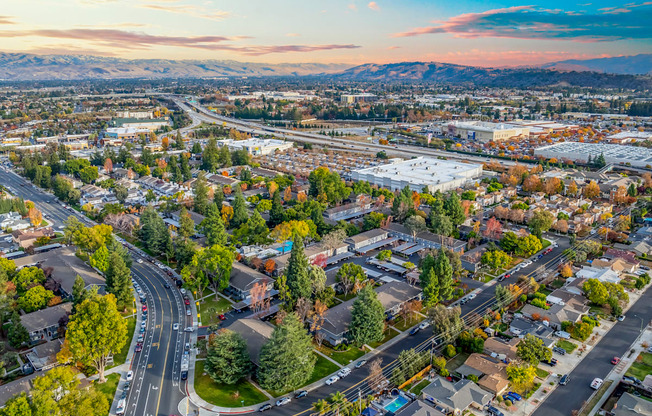 A suburban area with a road running through it.