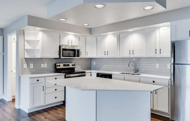 Large Kitchen with Recessed Lighting and Stainless Steel Appliances