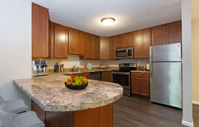 Laurel West End Apartments in Golden Valley, MN photo of kitchen with hardwood floors and stainless steel appliances