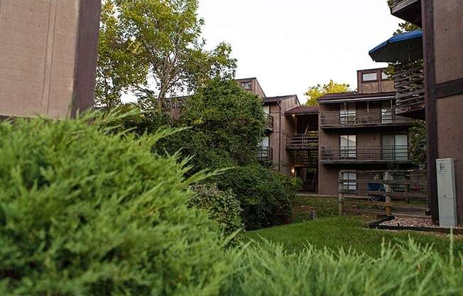 a view of the apartments from the grass