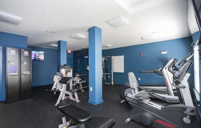 a room filled with lots of different types of exercise equipment