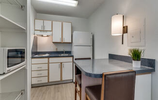 a kitchen with a counter top and a sink  at Waterford Studios, Texas, 78758