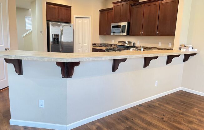 Spacious 4-Bedroom Home with Inviting Curb Appeal, Modern Kitchen, and Backyard Retreat