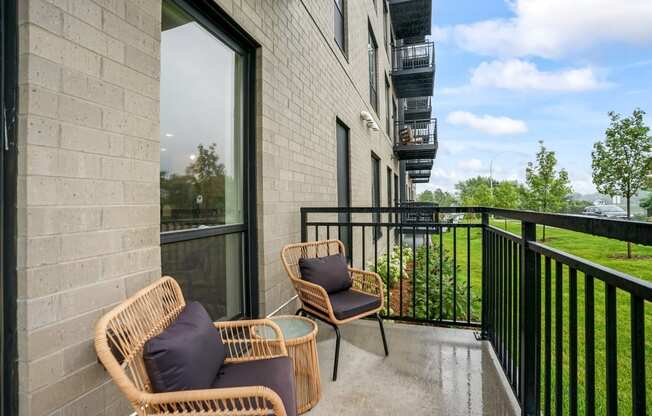 the reserve at city center spacious balcony with wicker chairs