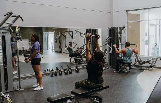 a group of people working out in a gym