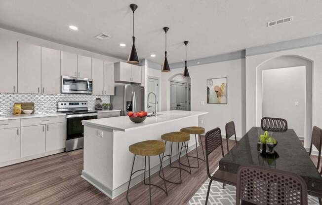 A modern kitchen with a dining table and chairs.