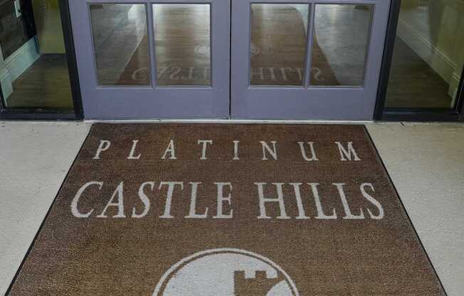 a welcome mat in front of a door to platinum castle hills