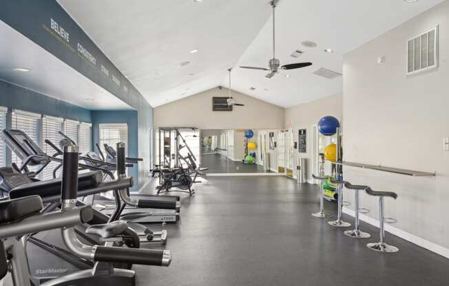 Alternate view of fitness room with stools and cardio machines at Davenport Apartments in Dallas, TX