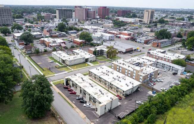 an aerial view of a city with buildings and cars at The Courts Midtown, Memphis, 38104