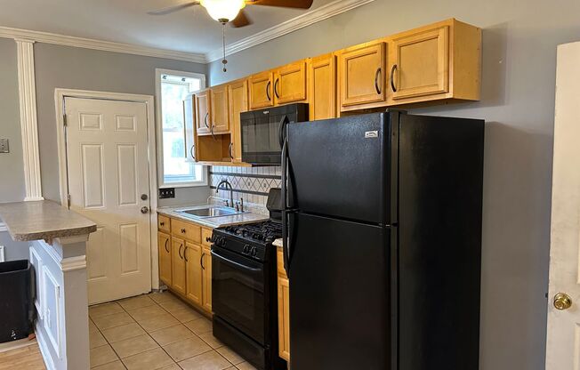 Spacious Home for Rent! Open Floor-Plan! Partially Finished Basement! Front Porch & Fenced in Yard! Available Now!