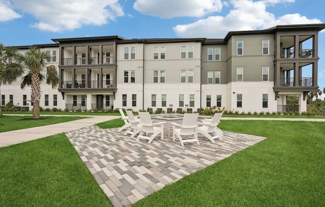 Exterior of The Crossing at Palm Aire with fire pit and seating
