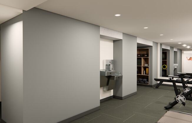 A gym with a row of treadmills on the right.