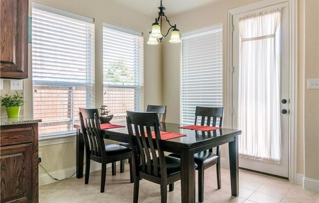 Grand entry, Open floor plan with high ceiling, Spacious rooms, Elegant kitchen featuring stainless steel appliances.