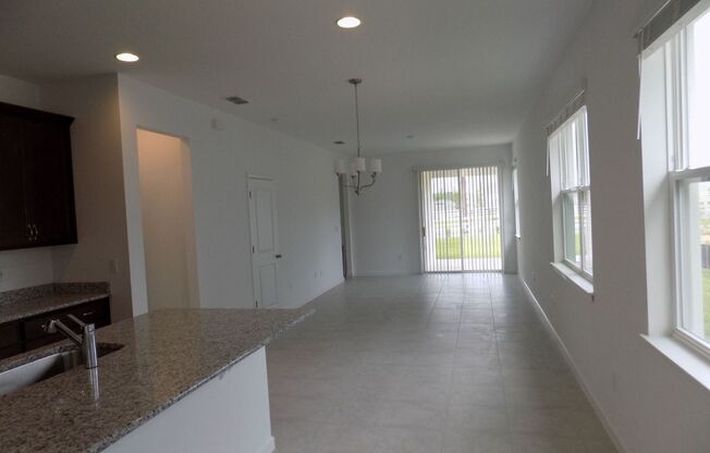 LOOKS LIKE NEW 4 BEDROOMS, 2 BATHS, 2 CAR GARAGE SINGLE FAMILY HOME IN CLERMONT