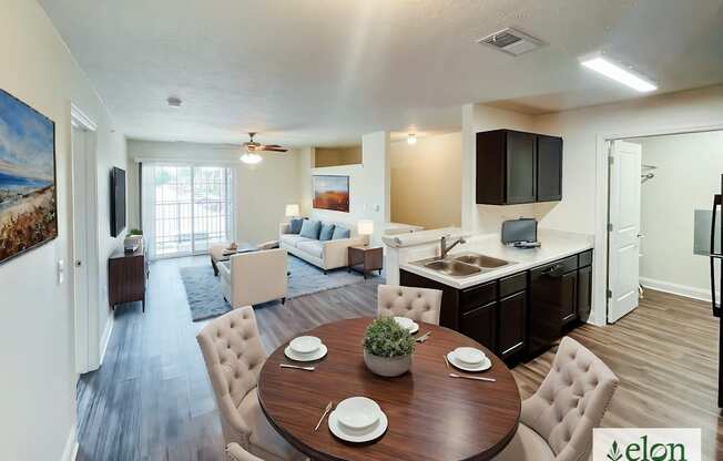 A dining room with a wooden table surrounded by chairs.