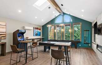 A modern dining room with a table and chairs.