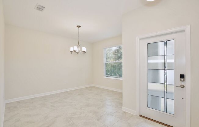 Luxurious 5/3 Modern Home with a Screened Patio and a 2 Car Garage in the Highly Desirable Storey Park - Orlando!