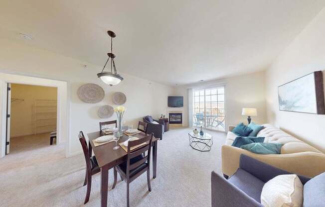 A living room with a dining table and a couch.