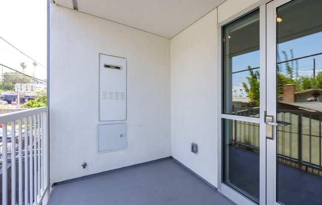 the entrance to a balcony with a sliding glass door