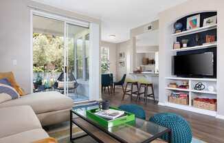 Apartments for Rent in Napa CA - Montrachet - Living Area with Beige Interiors, Wood-Style Flooring, and Sliding Glass Patio Doors