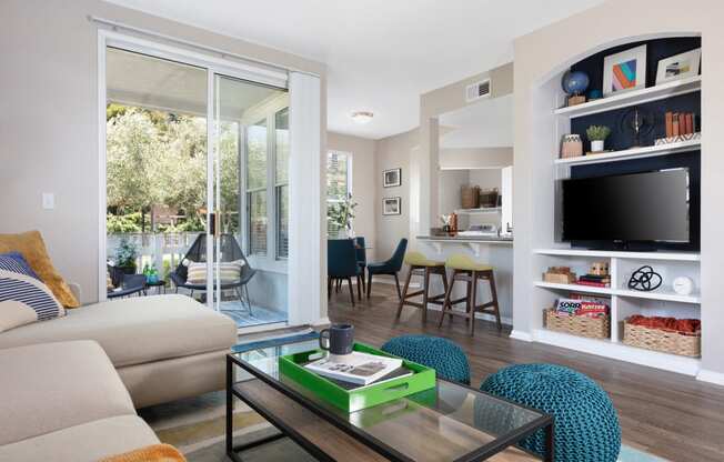 Apartments for Rent in Napa CA - Montrachet - Living Area with Beige Interiors, Wood-Style Flooring, and Sliding Glass Patio Doors