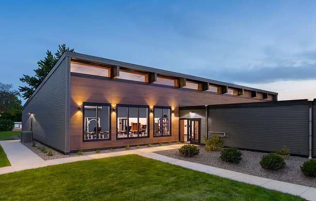 a modern house with a garage and a lawn