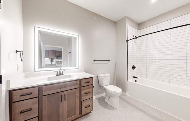 a bathroom with a sink toilet and a shower