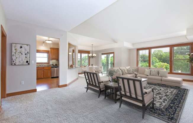 Laurel East End Apartments in Golden Valley, MN photo of a living room with a couch and a table and chairs