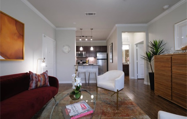 spacious open-concept apartment with hardwood-inspired flooring at Park at Magnolia apartments