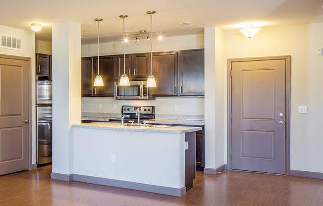 a kitchen with a center island and a stove top oven