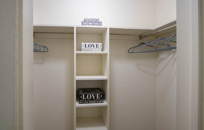 The bedroom ealk-in closet in a 515 square foot 1 bedroom, 1 bath apartment home at Canyon Creek Apartments in Dallas Midtown neighborhood of Dallas, TX.