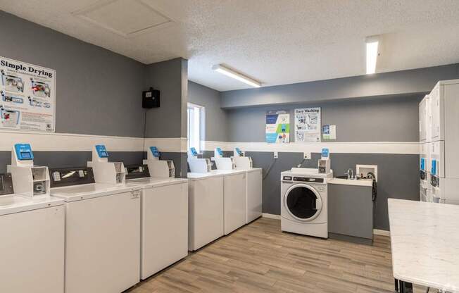 A laundromat with washers and dryers.