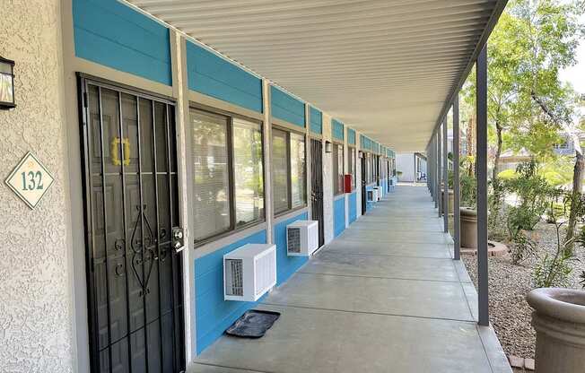 A long building with a blue stripe on the side.