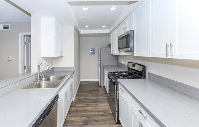 a kitchen with a sink and a window