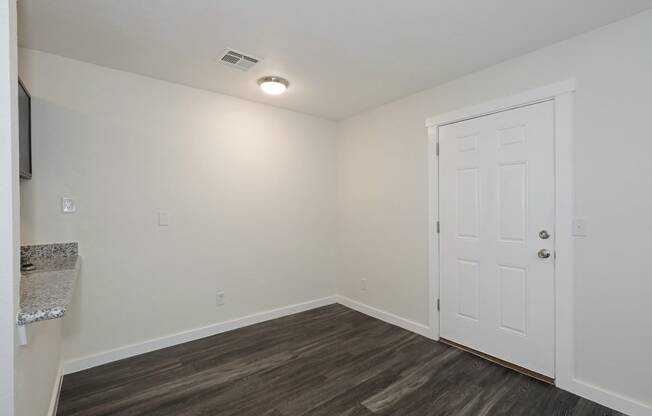 a bedroom with hardwood flooring and white walls at Bennett Ridge Apartments, Oklahoma City, OK, 73132