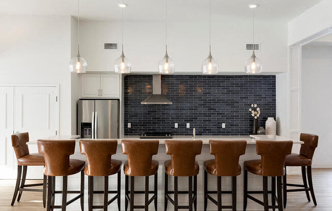 Stunning navy backsplash in clubroom kitchen at Waterstone Place in Minnetonka