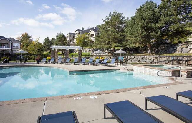 Pool Area with Seating at Stone Cliff Apartments