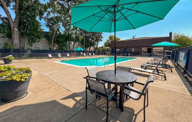 Heated pool and fenced in sundeck at Knottingham Apartments in Clinton Township, MI.