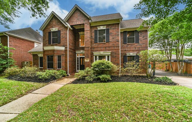 Executive two-story home nestled in the desirable Brookwood neighborhood!