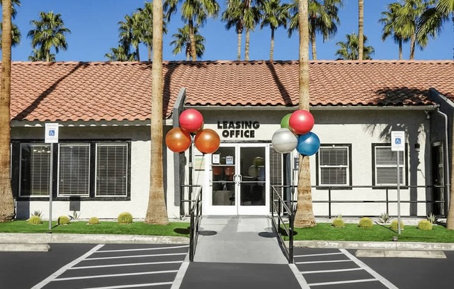 A building with a red roof and a sign that says